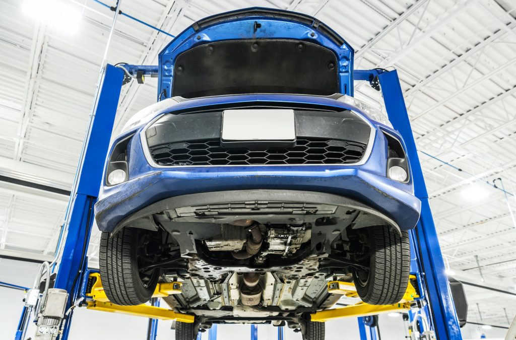 Vehicle on an Automotive Lift During Maintenance