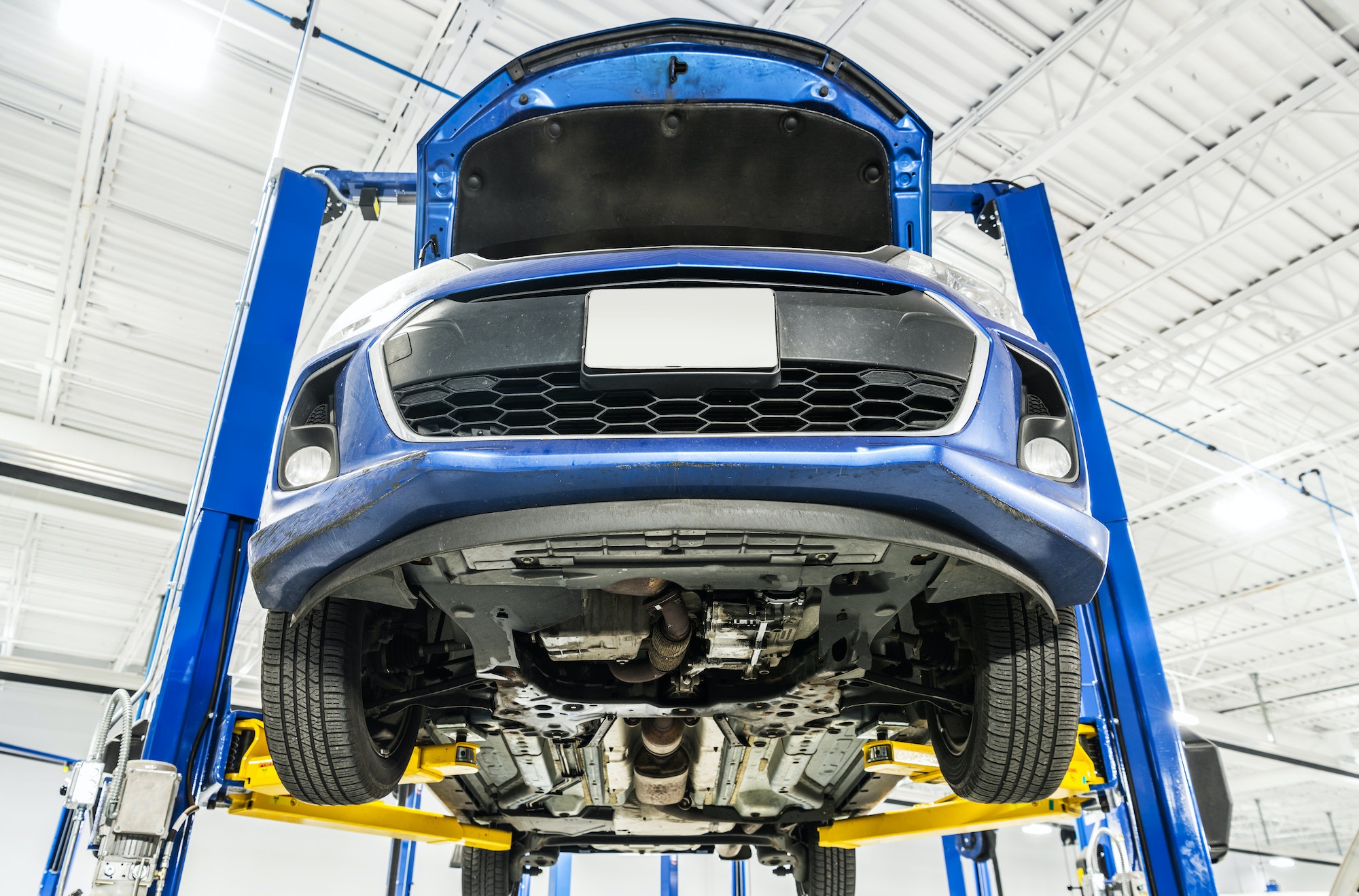 Vehicle on an Automotive Lift During Maintenance